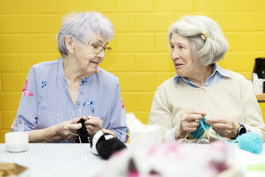 Two women are knitting.