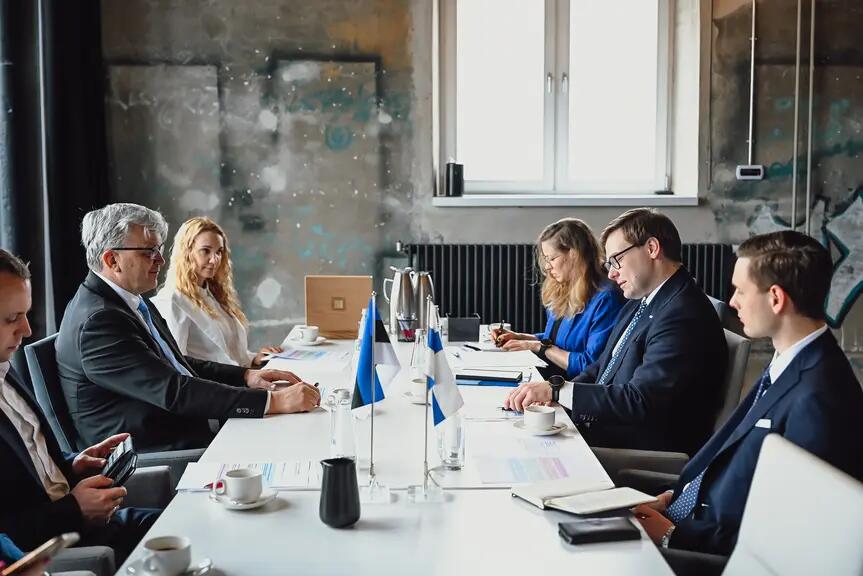 A company sitting around a table