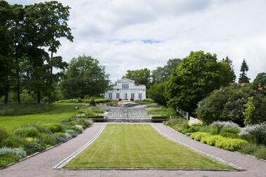 Annala Villa Park’s perennial plantings with Villa Annala in the background.